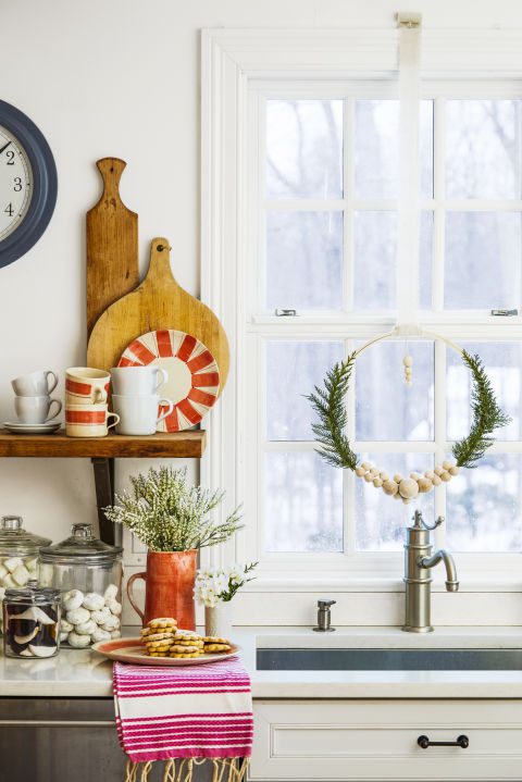 Fancy up your view with a unique wreath made from an embroidery hoop or a garland of lush greenery. What you'll need: embroidery hoop ($9, amazon.com), glue gun ($11, amazon.com)