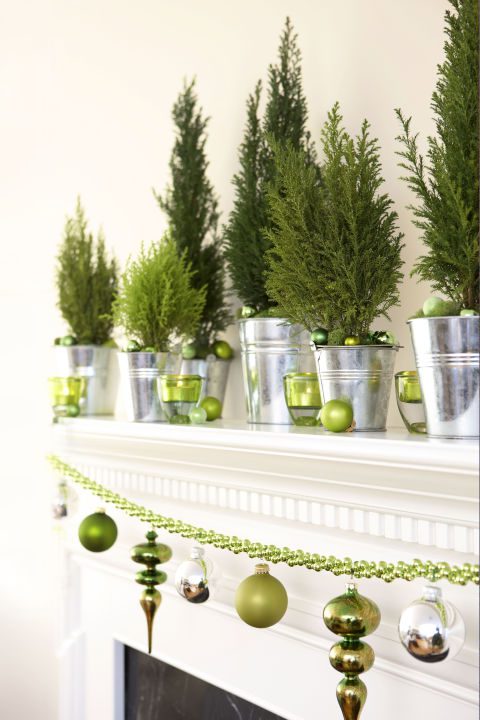 Plunked in galvanized pails, spruce seedlings keep the greenery coming. Add some sparkle by securing ornaments to a bead garland with floral wire. What you'll need: galvanized buckets ($20 for 12, amazon.com), green ornaments ($17, amazon.com)